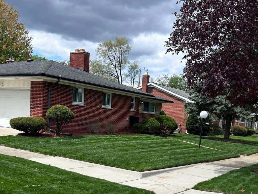 Brick ranch with a freshly striped front lawn